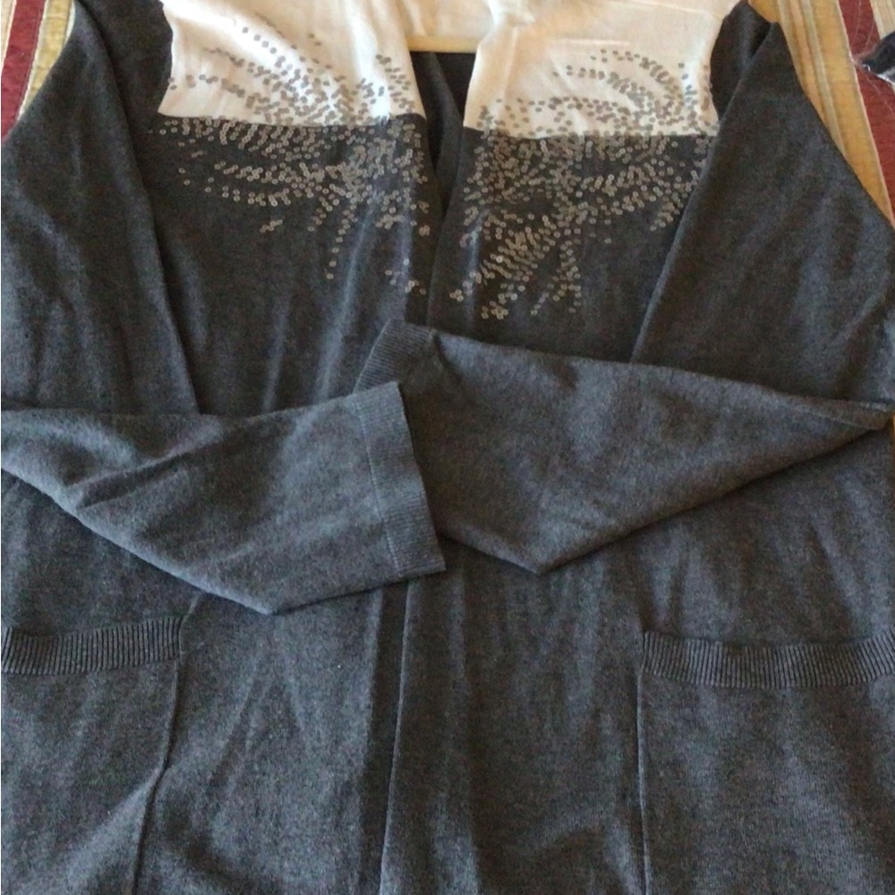Gray and white with silver Embellishment’s on the front